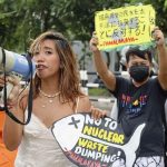 マニラの日本大使館前で漁業者らがデモを行い、「東京湾に投棄しないのか」と抗議